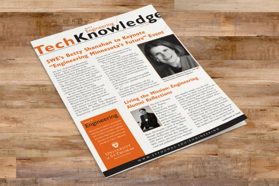 Mockup of the TechKnowledge newsletter on a wood surface.