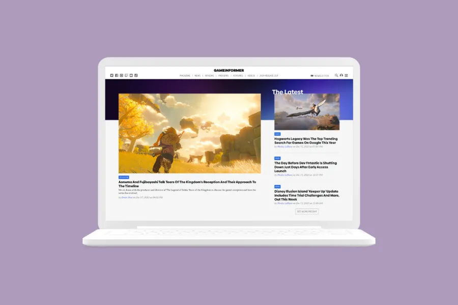 Rendering of the Game Informer home page redesign on a laptop.